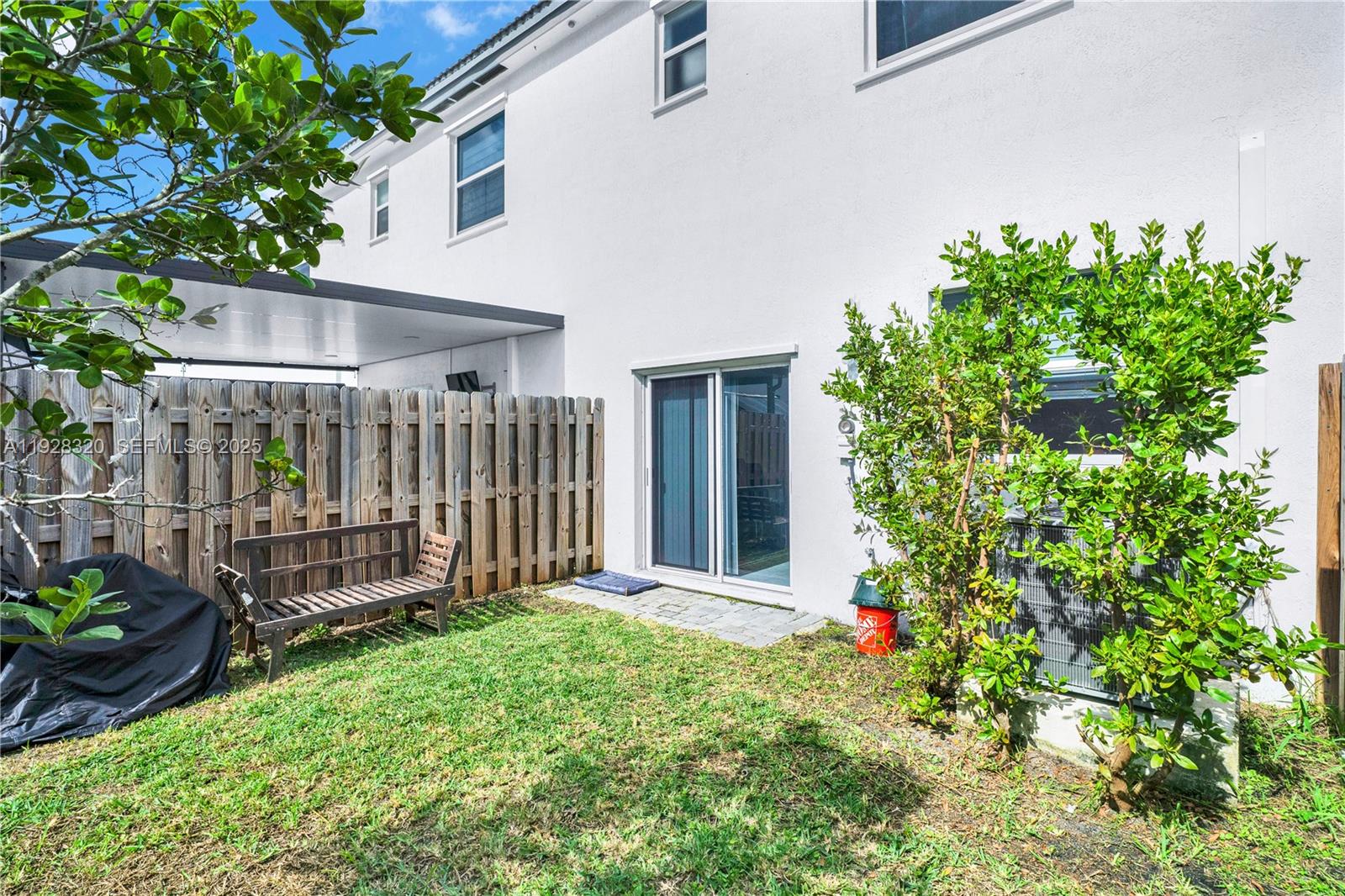 16266 Southwest 291st Street Homestead, FL 33033 - Photo 30 of 34 a view of a house with garden and plants
