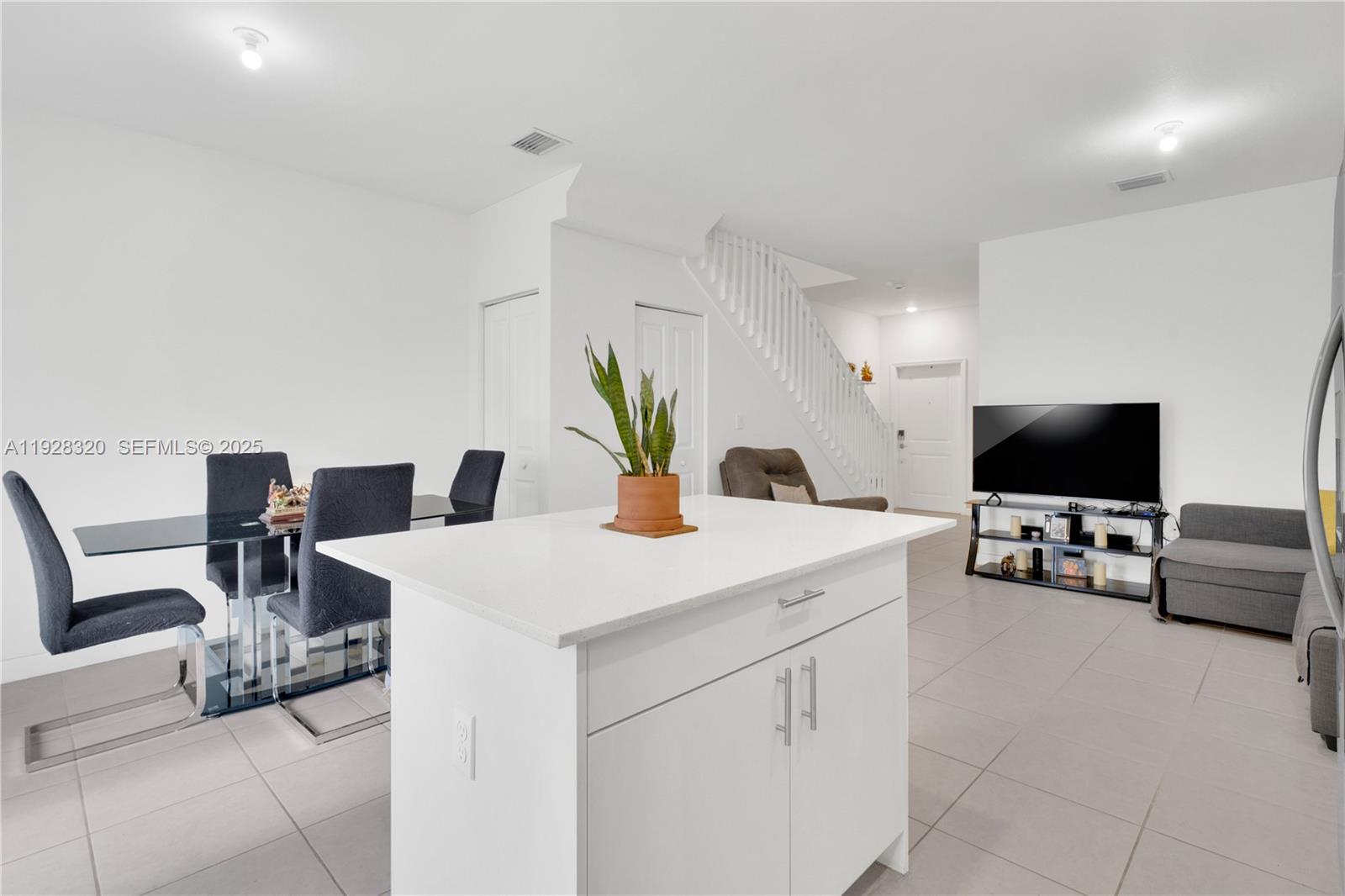 16266 Southwest 291st Street Homestead, FL 33033 - Photo 7 of 34 a living room with furniture and a flat screen tv