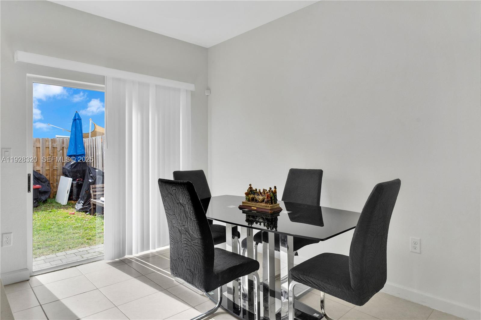 16266 Southwest 291st Street Homestead, FL 33033 - Photo 8 of 34 a view of a dining room with furniture window and wooden floor