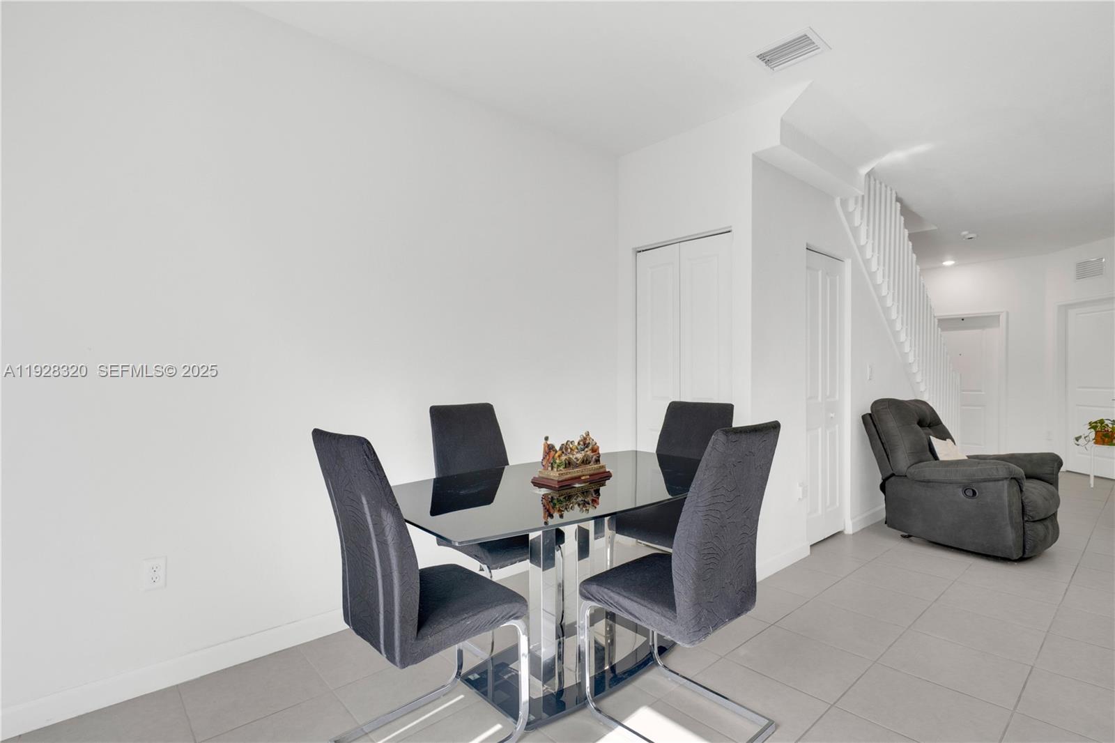 16266 Southwest 291st Street Homestead, FL 33033 - Photo 9 of 34 a view of a dining room with furniture