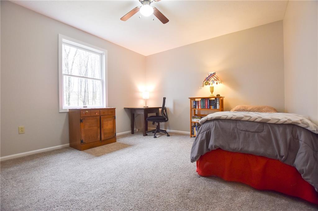 542 Fisher Road Cabot, PA 16023 - Photo 11 of 23 a bedroom with a bed and a window