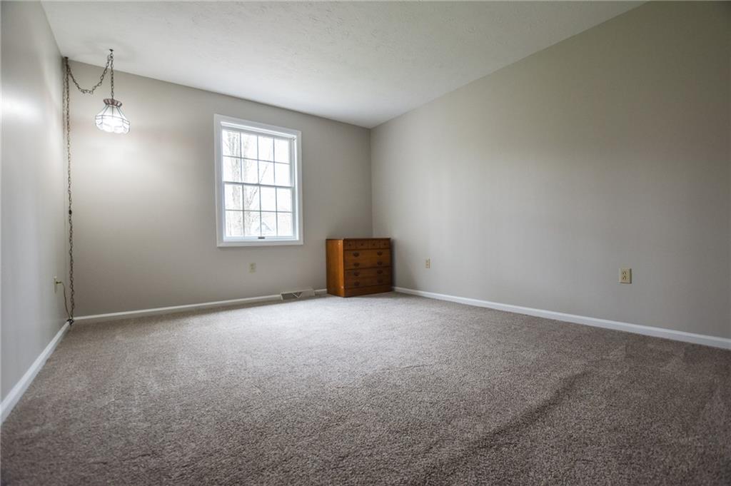 542 Fisher Road Cabot, PA 16023 - Photo 12 of 23 an empty room with windows and closet