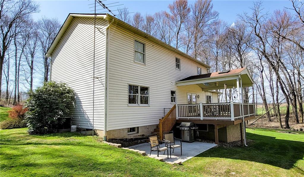 542 Fisher Road Cabot, PA 16023 - Photo 19 of 23 a view of house with a yard