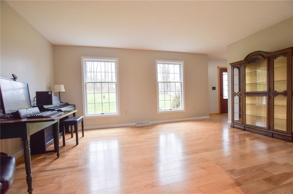 542 Fisher Road Cabot, PA 16023 - Photo 2 of 23 a view of a workspace with furniture and a window