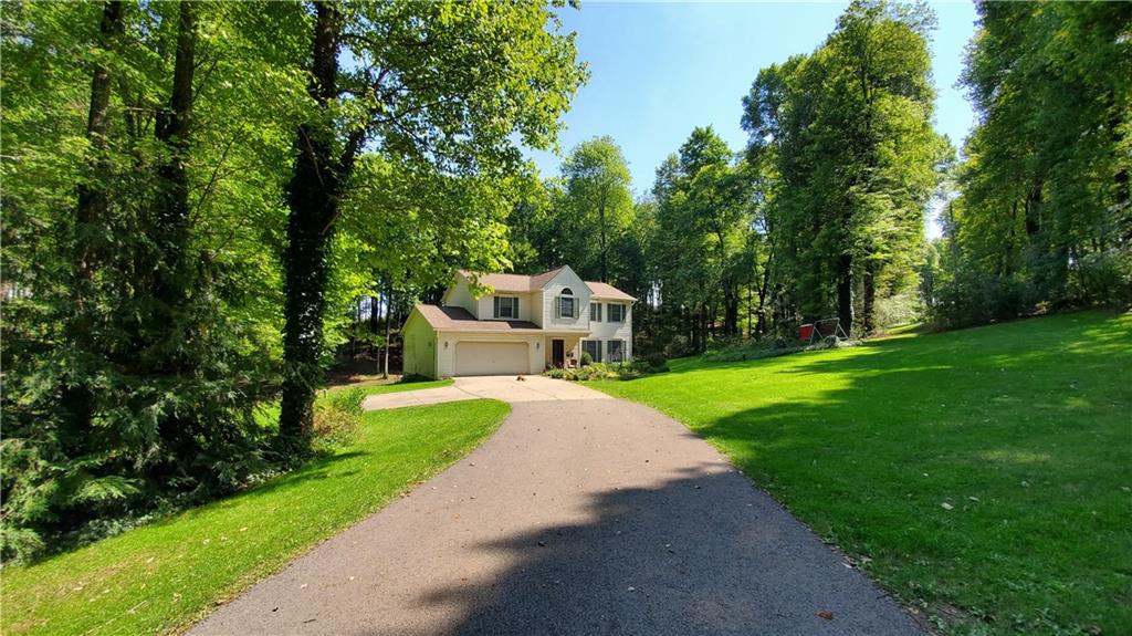 542 Fisher Road Cabot, PA 16023 - Photo 22 of 23 a view of a house with a small yard