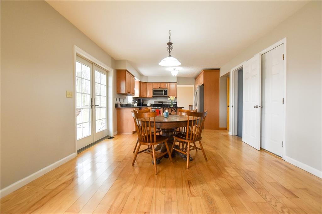 542 Fisher Road Cabot, PA 16023 - Photo 6 of 23 a view of a dining room with furniture window and wooden floor
