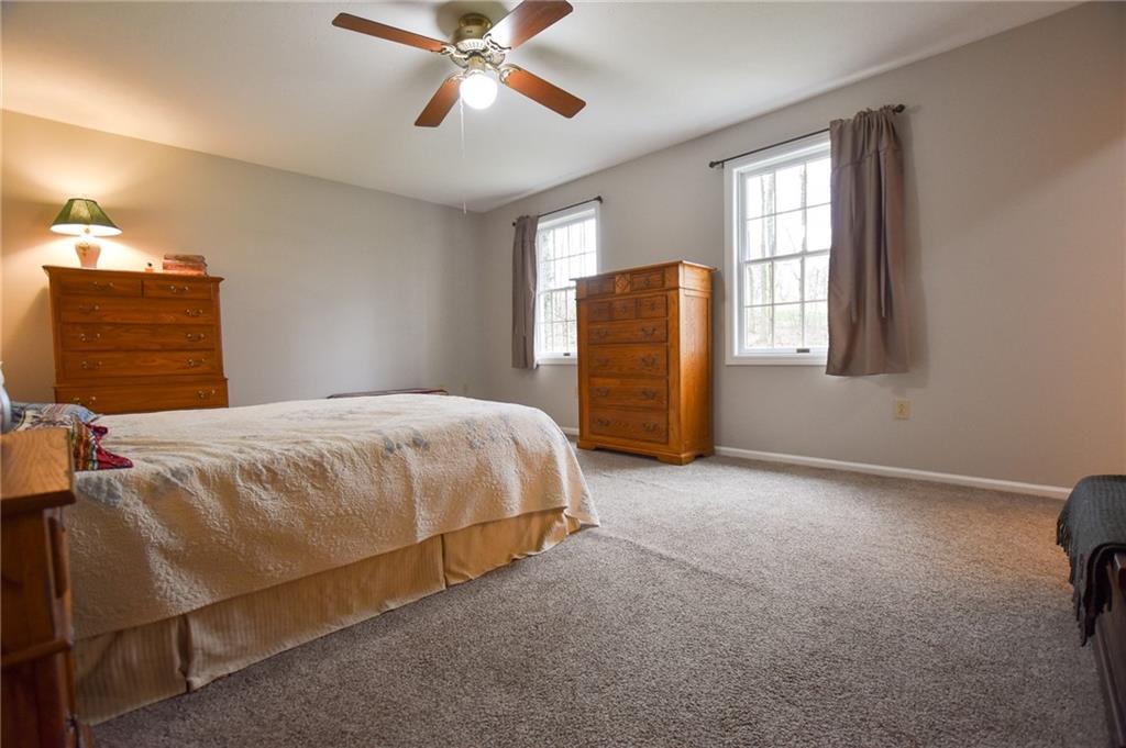 542 Fisher Road Cabot, PA 16023 - Photo 8 of 23 a bedroom with a bed and window