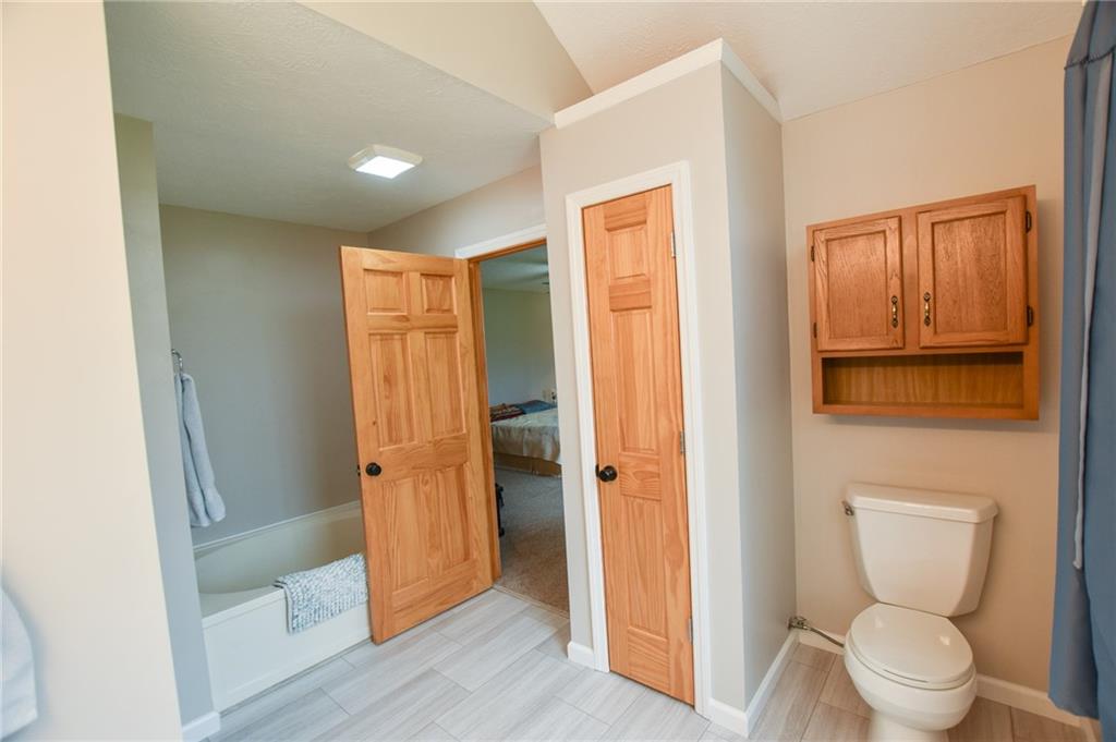 542 Fisher Road Cabot, PA 16023 - Photo 10 of 23 a bathroom with a toilet and a shower