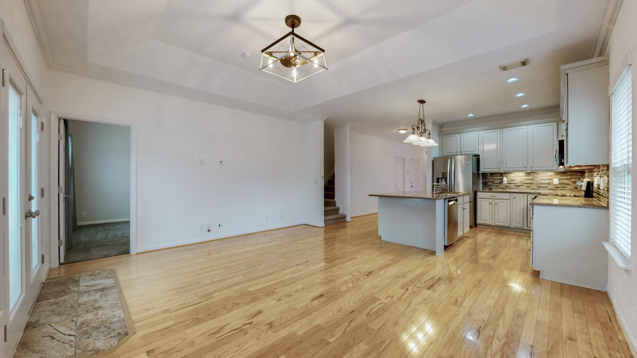 1098 Misty Morn Circle Spring Hill, TN 37174 - Photo 11 of 23 a view of kitchen with stainless steel appliances kitchen island granite countertop a refrigerator oven a stove and a sink with granite countertops