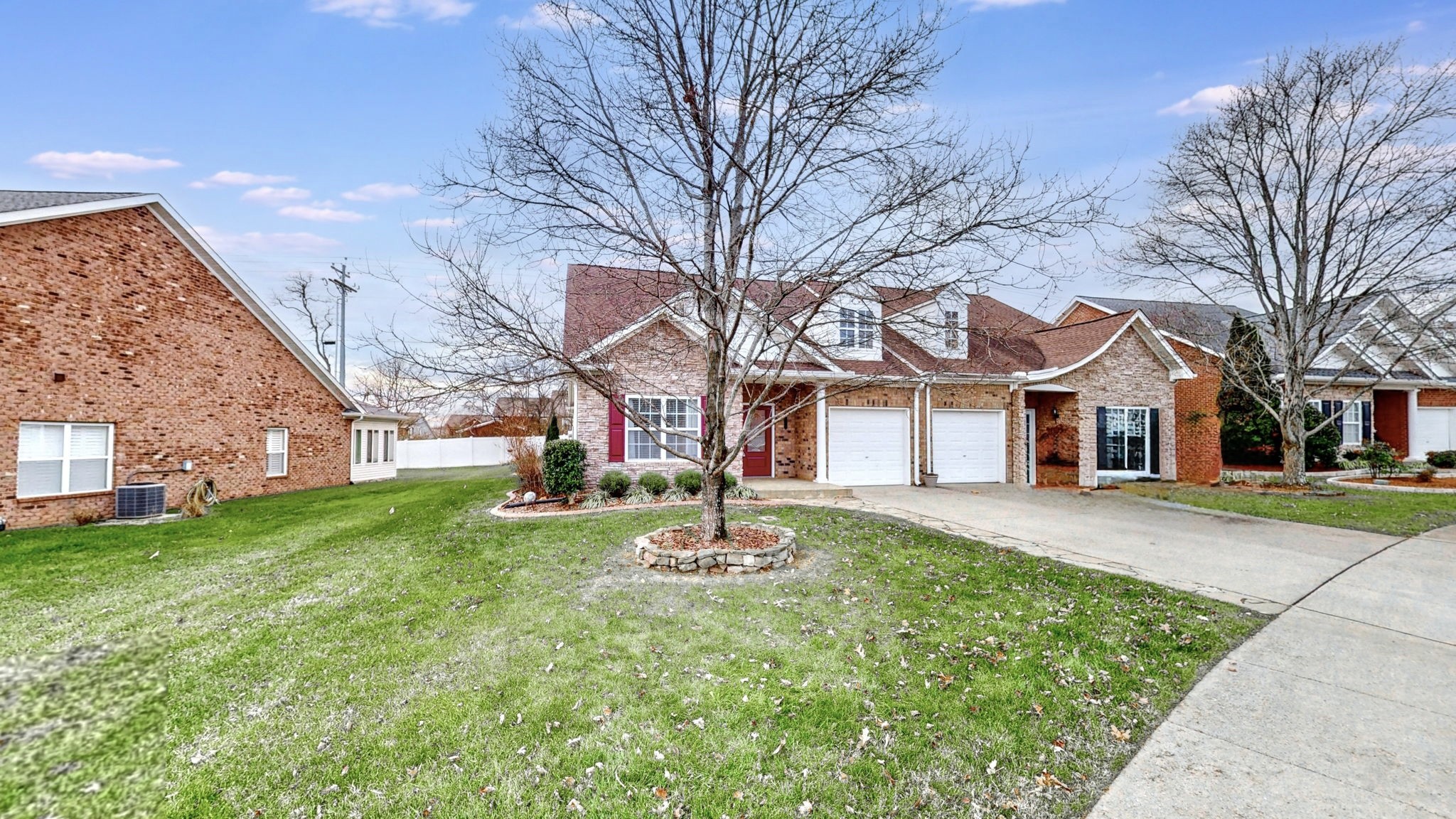 1098 Misty Morn Circle Spring Hill, TN 37174 - Photo 2 of 23 a front view of a house with a yard and trees
