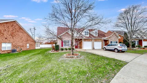 a house with trees in the background