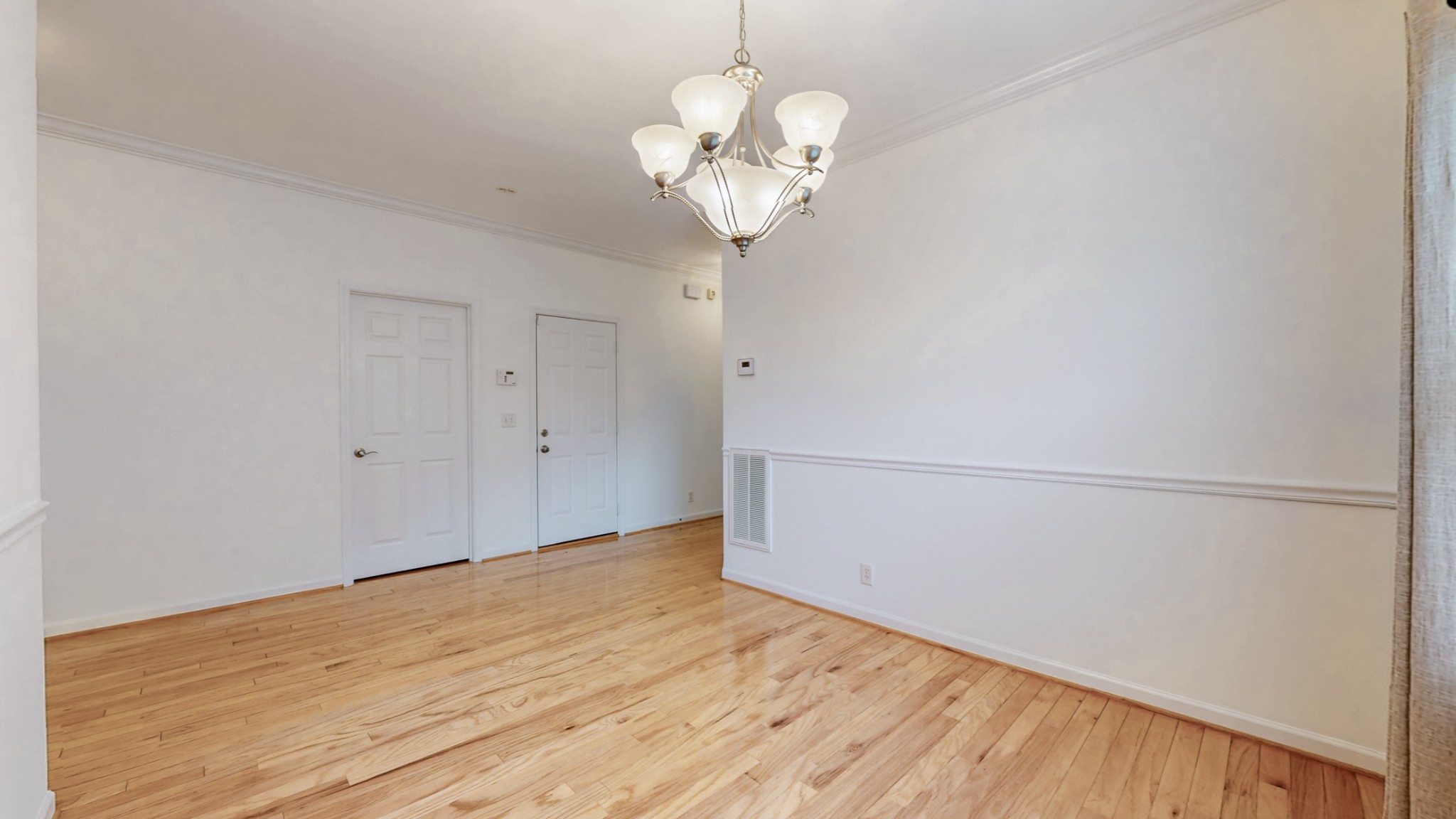 1098 Misty Morn Circle Spring Hill, TN 37174 - Photo 7 of 23 a view of a room with wooden floor and chandelier