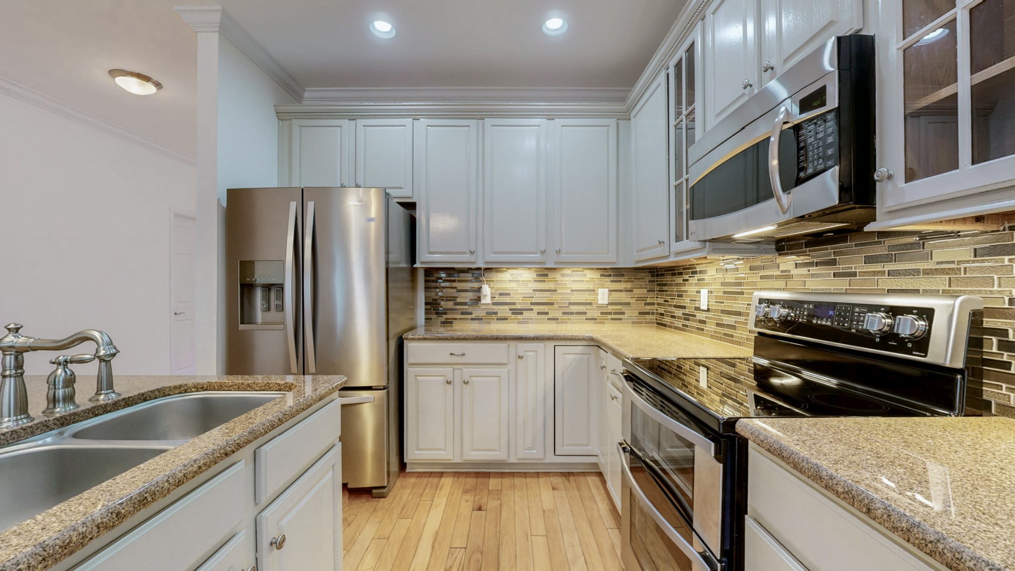 1098 Misty Morn Circle Spring Hill, TN 37174 - Photo 8 of 23 a kitchen with stainless steel appliances granite countertop a sink stove and refrigerator