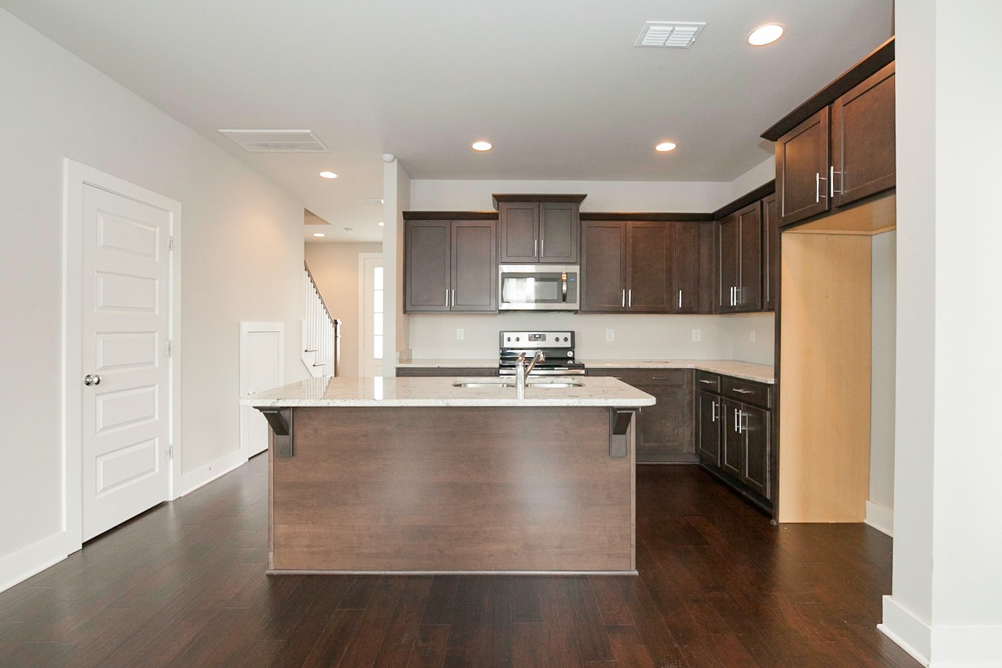 703 Cottage Park Drive Nashville, TN 37207 - Photo 2 of 15 a kitchen with kitchen island a sink a stove a refrigerator and a refrigerator