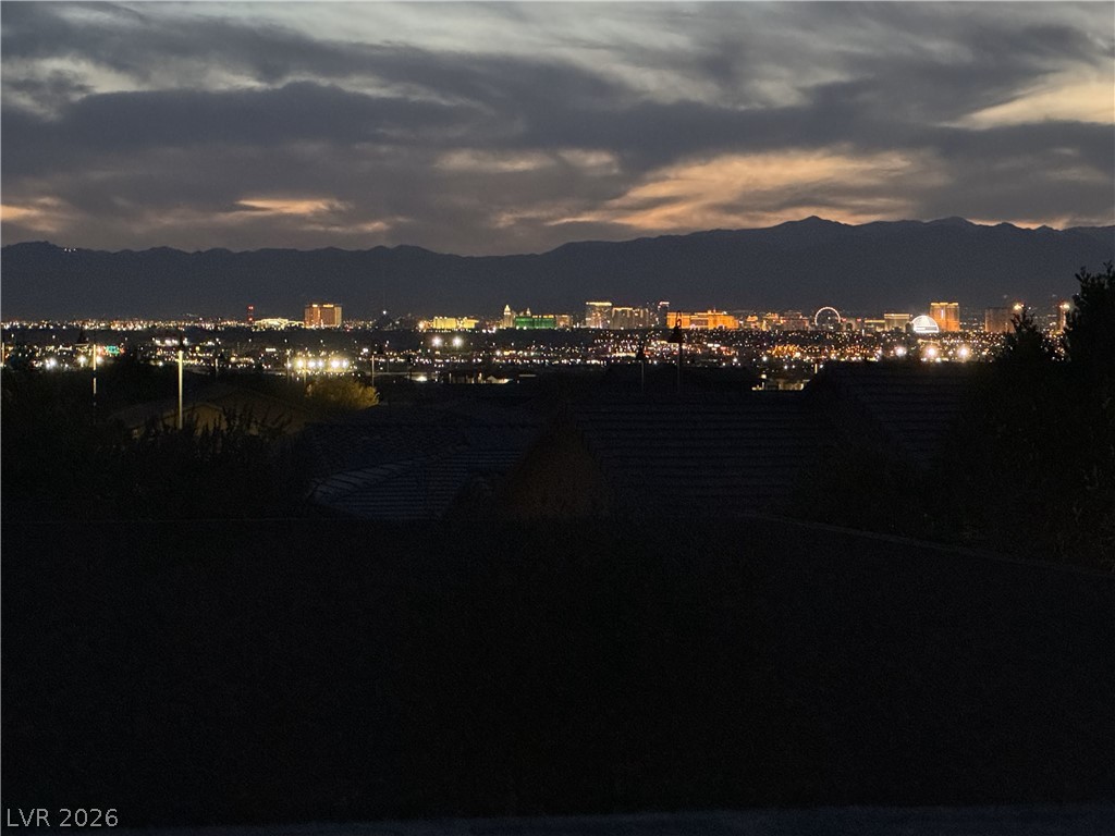 498 Pebble Run Avenue Henderson, NV 89011 - Photo 28 of 47 Capture the magic of twilight with this view overlooking a sparkling city skyline.