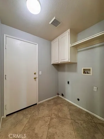 an empty room with closet area