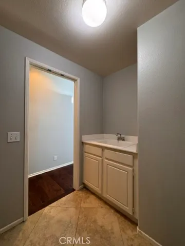 a spacious bathroom with a double vanity sink a mirror and shower