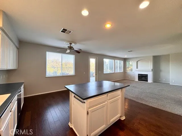 a view of a livingroom with furniture and a floor to ceiling window