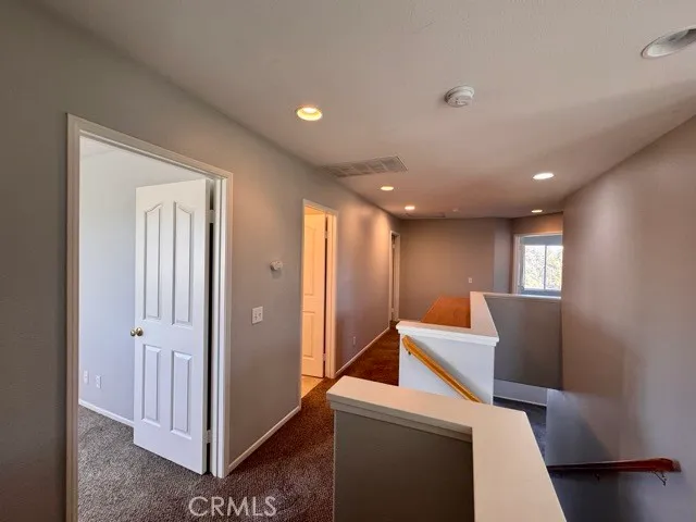 a bathroom with a double vanity sink a mirror and a bathtub