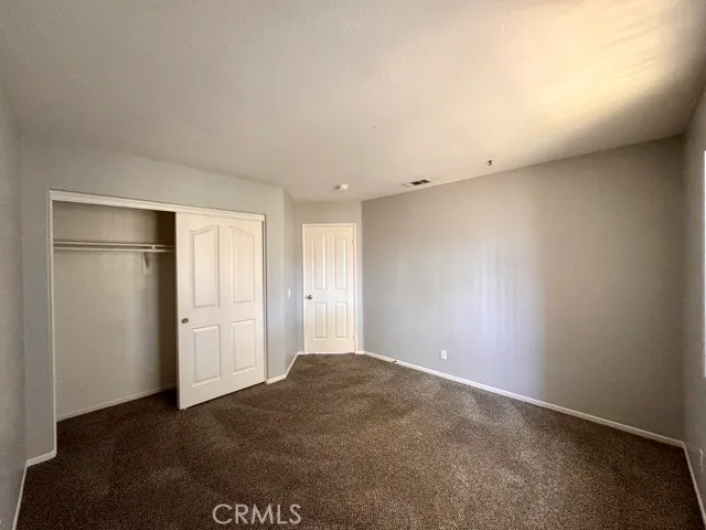 a spacious bathroom with a double vanity sink and a mirror