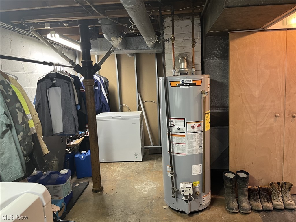15705 Rockside Road Maple Heights, OH 44137 - Photo 28 of 37 Utility room featuring gas water heater