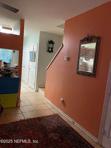 a view of a hallway with entryway