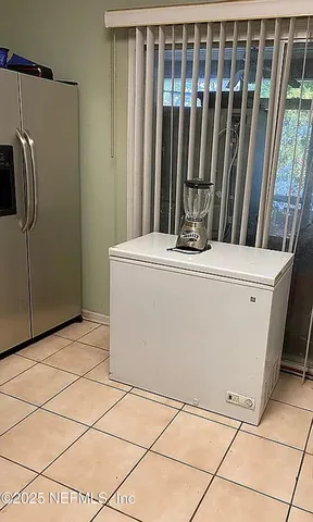 a view of a refrigerator in the kitchen