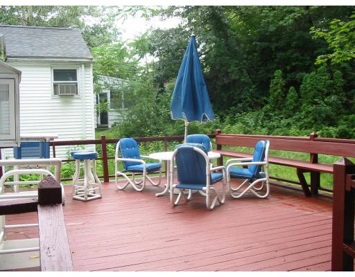 36 Longwell Road Newton, MA 02462 - Photo 3 of 8 a view of a patio with a dining table and chairs with wooden floor