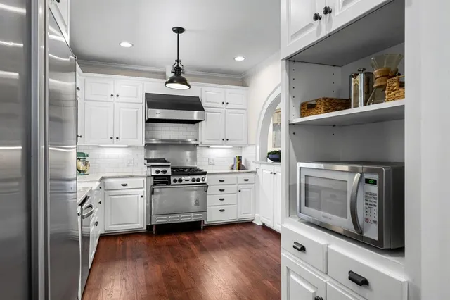 a bedroom with furniture and a chandelier