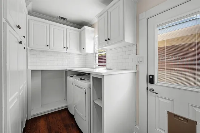 a spacious bedroom with a bed and a window