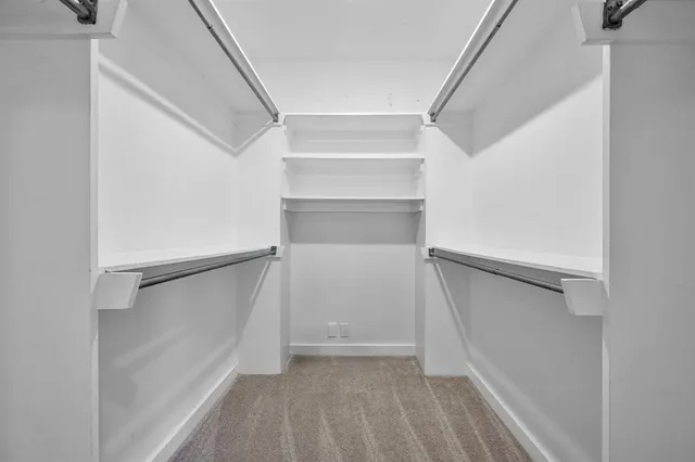 a living room with furniture fireplace and window