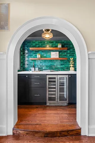 a view of backyard with barbeque grill and stairs