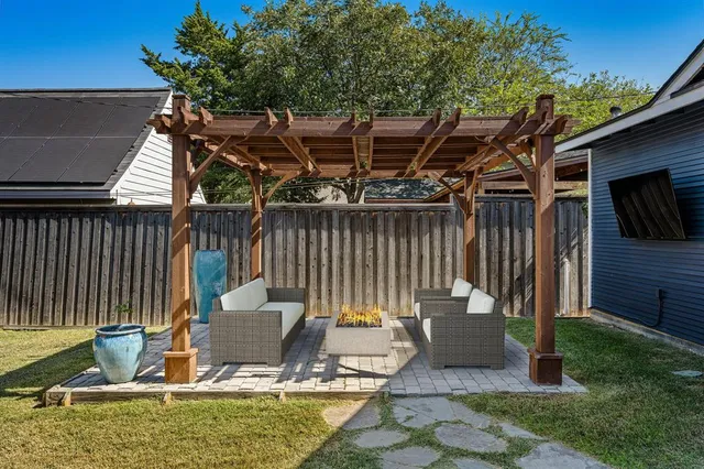 an empty room with wooden floor and fireplace