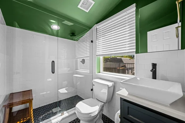 a backyard of a house with swimming pool and porch