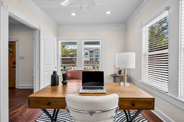 a view of a dining room with furniture wooden floor and chandelier