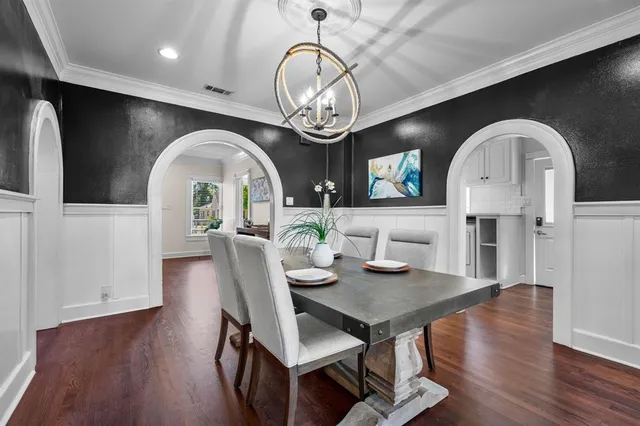 a kitchen with stainless steel appliances a sink and cabinets