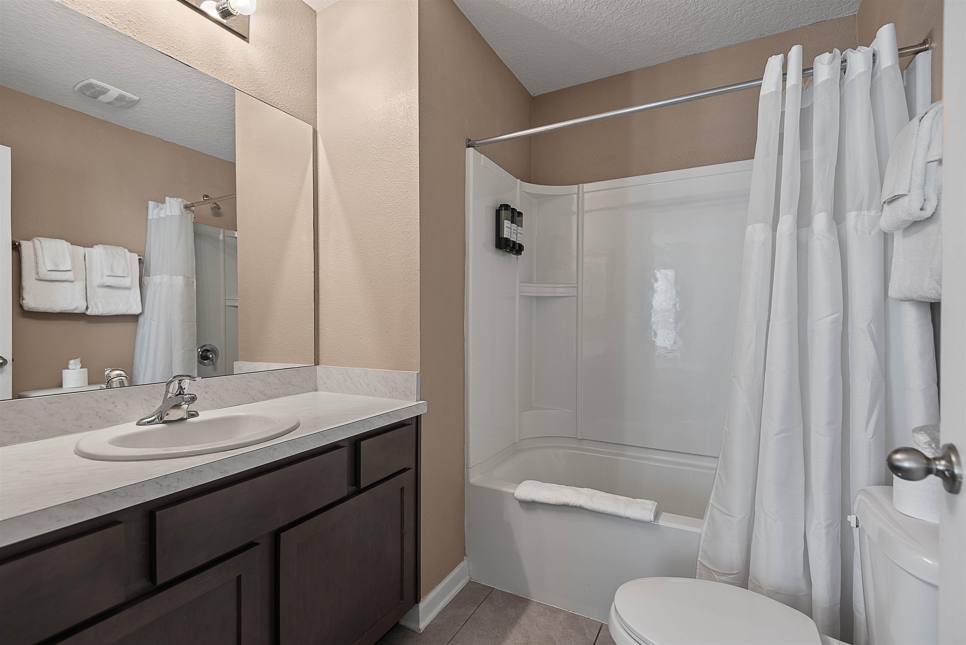 877 Rotary Road Jacksonville, FL 32211 - Photo 12 of 36 a bathroom with a sink toilet and shower