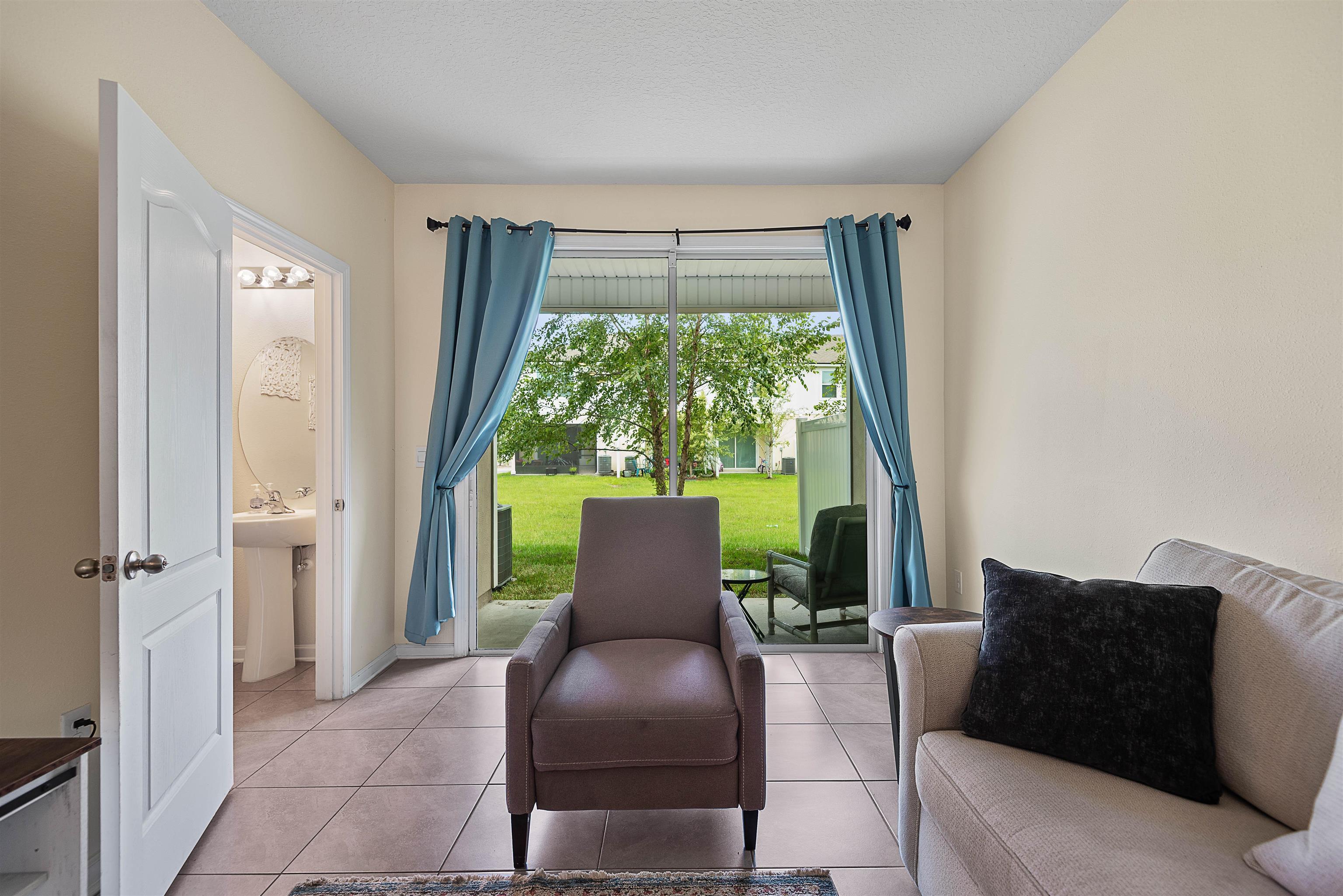 877 Rotary Road Jacksonville, FL 32211 - Photo 17 of 36 a living room with furniture and a window