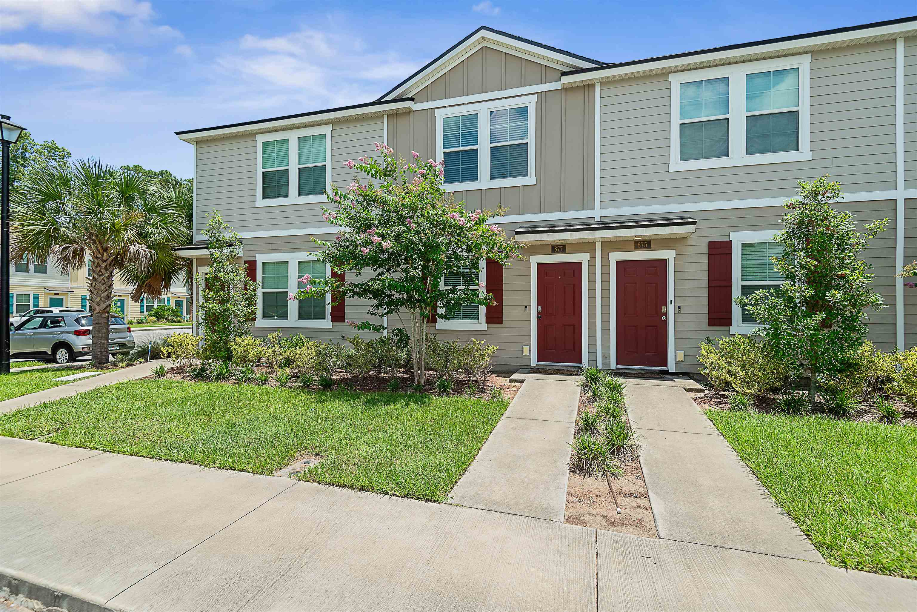 877 Rotary Road Jacksonville, FL 32211 - Photo 20 of 36 a front view of a house with a yard