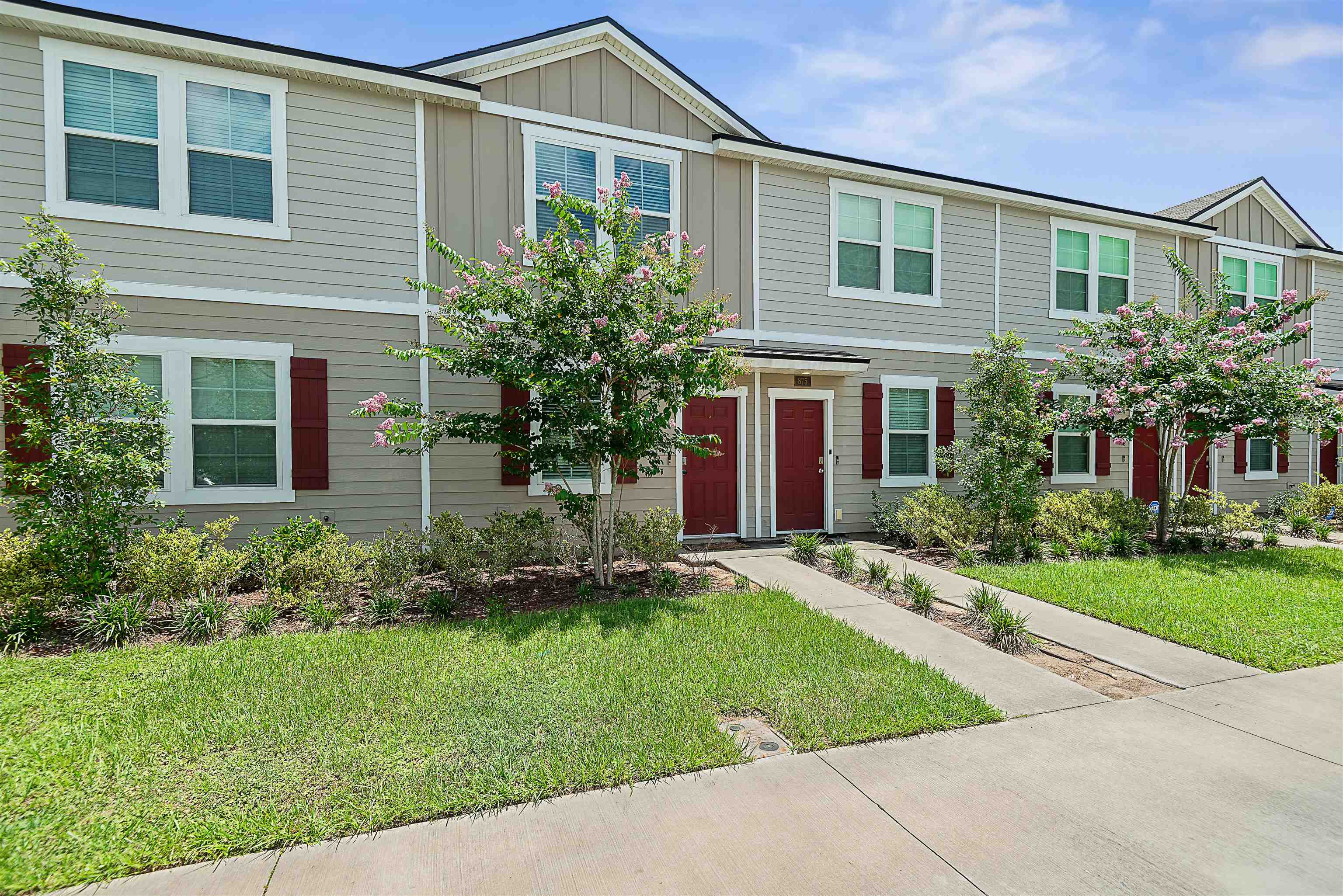 877 Rotary Road Jacksonville, FL 32211 - Photo 22 of 36 a front view of a house with a yard and trees