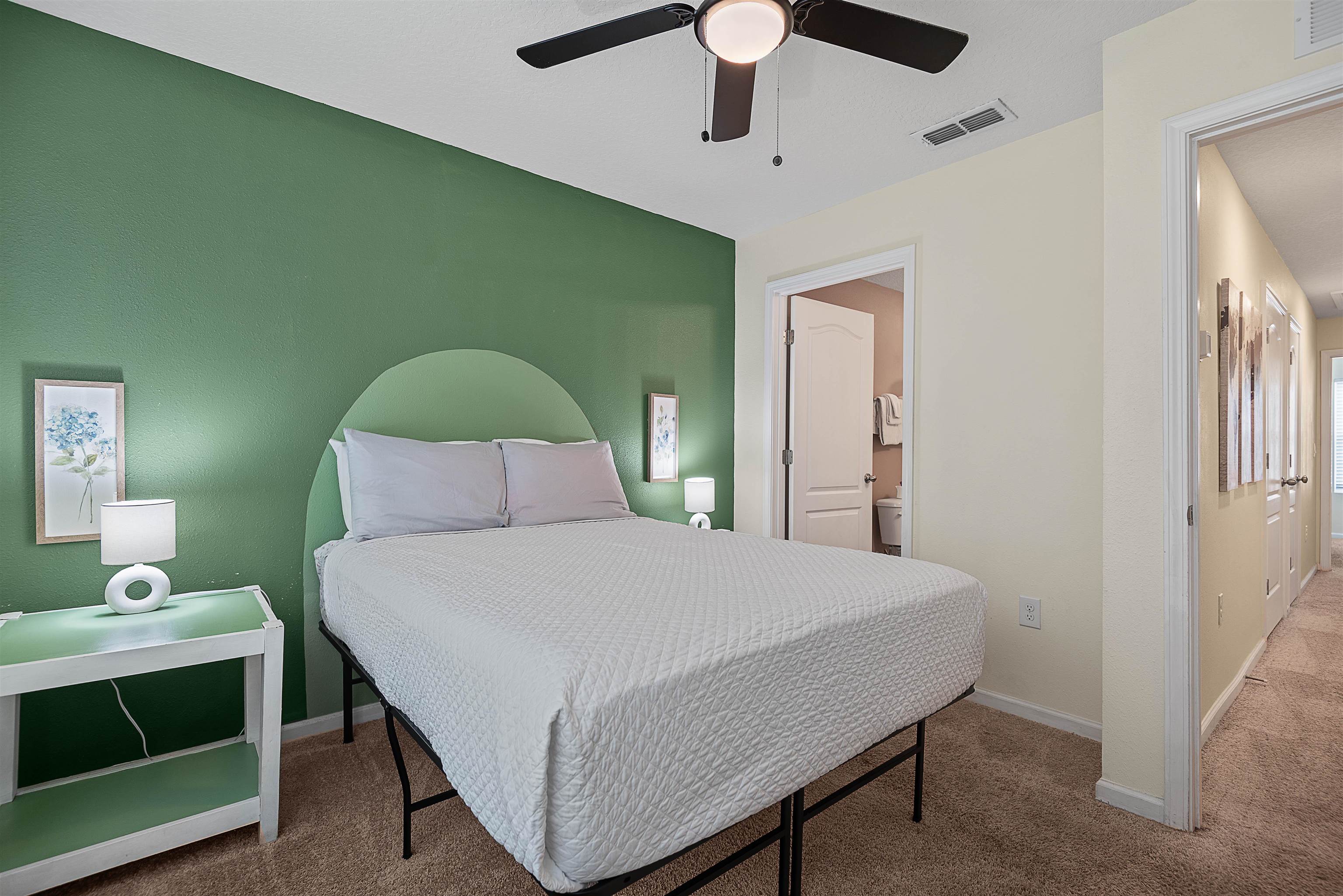 877 Rotary Road Jacksonville, FL 32211 - Photo 31 of 36 a bedroom with a bed and a dresser