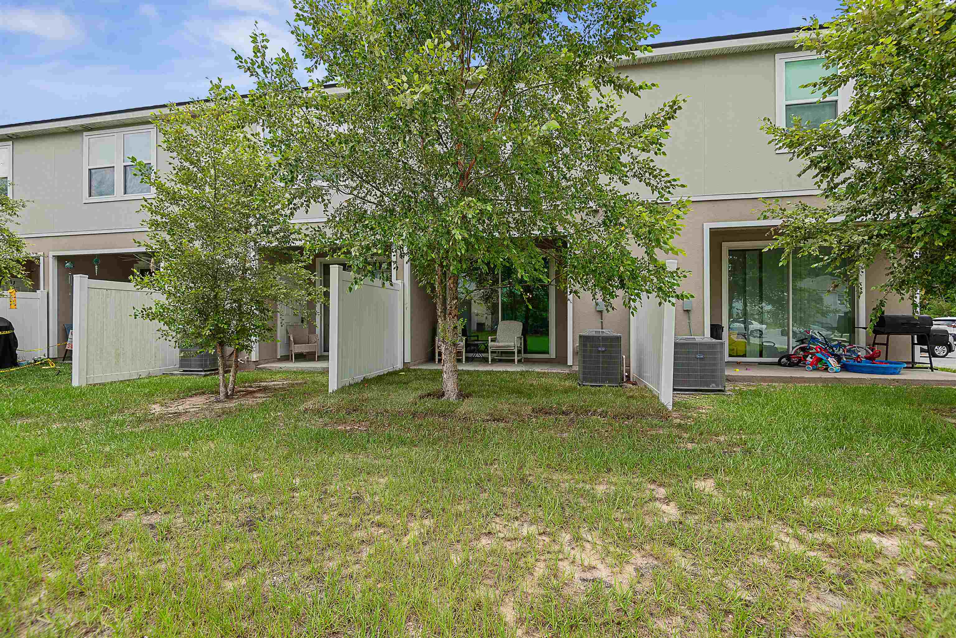 877 Rotary Road Jacksonville, FL 32211 - Photo 34 of 36 a backyard of a house with plants and large tree