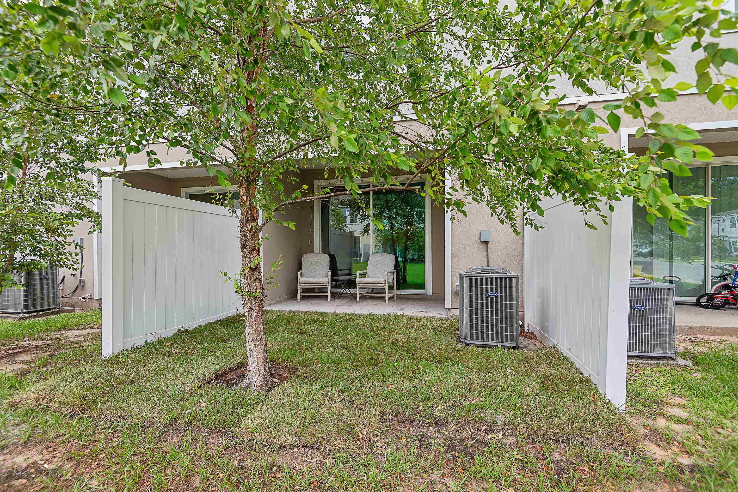 877 Rotary Road Jacksonville, FL 32211 - Photo 36 of 36 a view of a house with backyard and a tree