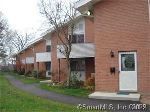 208 Flax Hill Road, Unit 31 Norwalk, CT 06854 - Photo 1 of 1 a front view of a house with a yard