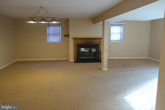 an empty room with a fireplace