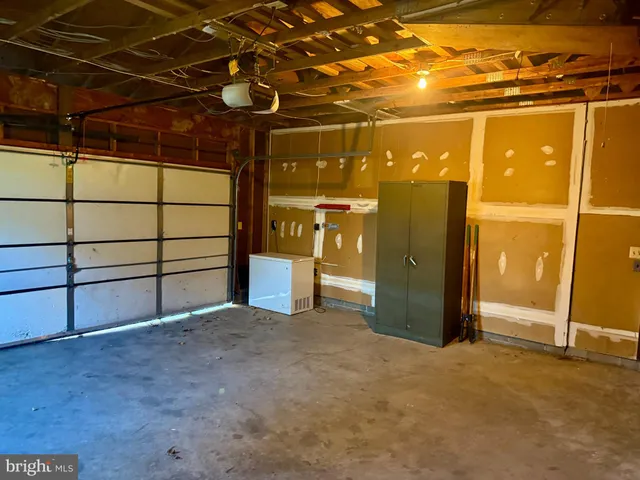 a view of a room with wooden walls