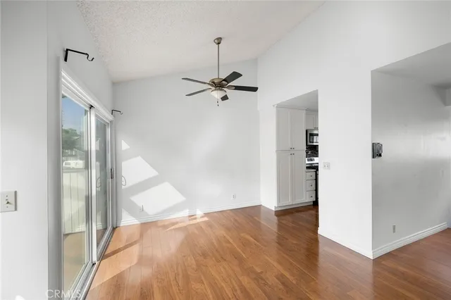 wooden floor in an empty room with a windows
