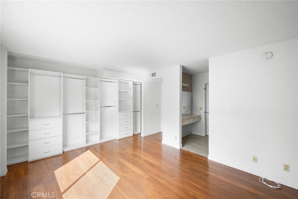 10475 Newhome Avenue, Unit 6 Sunland, CA 91040 - Photo 19 of 28 a view of empty room with wooden floor