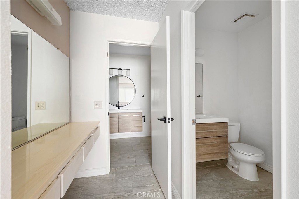 10475 Newhome Avenue, Unit 6 Sunland, CA 91040 - Photo 20 of 28 a bathroom with a toilet sink and shower