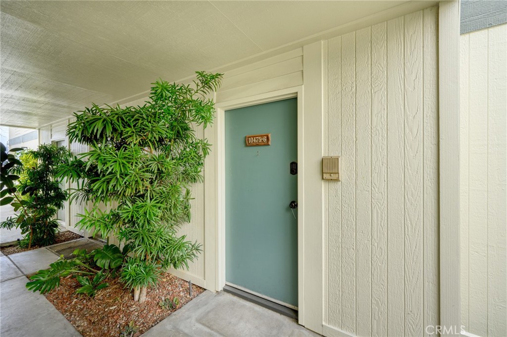 10475 Newhome Avenue, Unit 6 Sunland, CA 91040 - Photo 2 of 28 a door with a potted plant in front of it